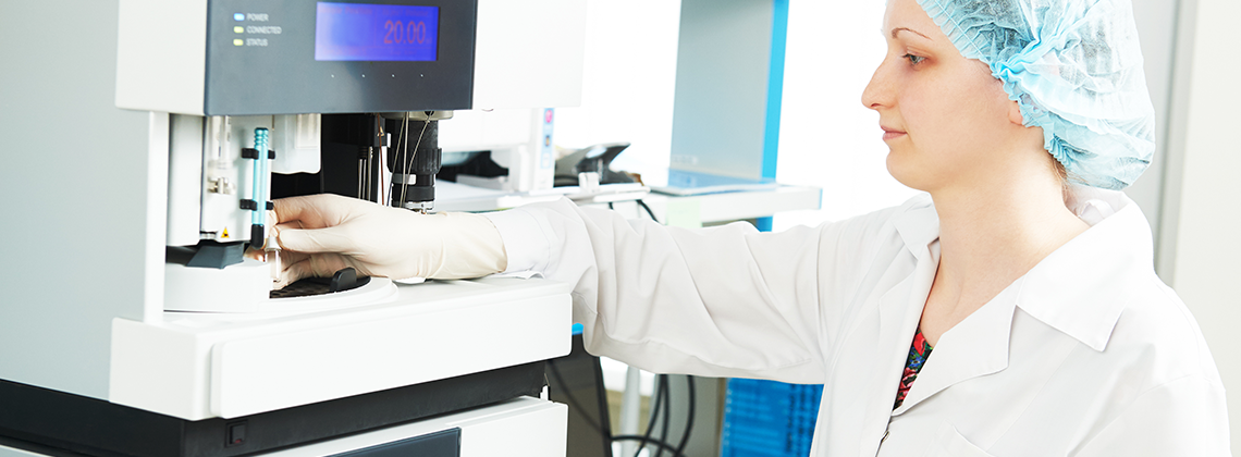 Woman using Liquid Chromatograph